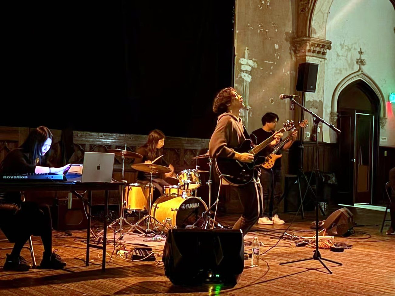 Mang Rope performing, singer and guitarist, warm stage light