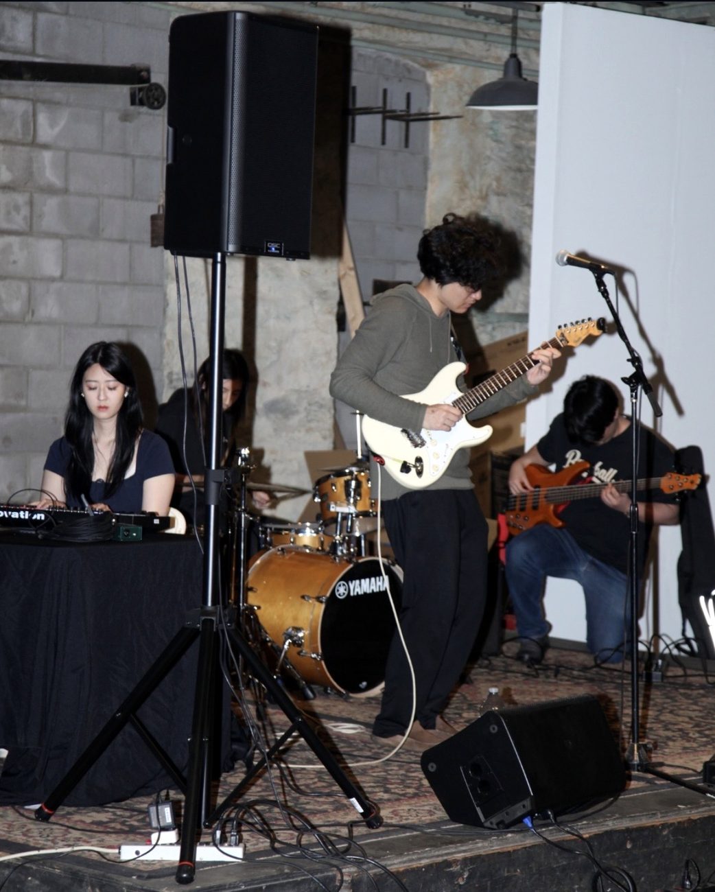 Mang Rope performing in a historic venue, wide atmospheric view