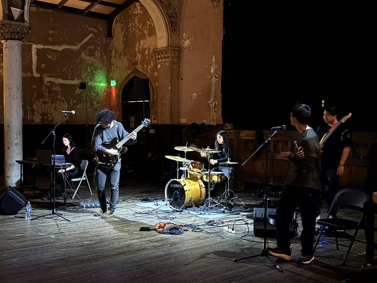 Mang Rope performing, warm stage light